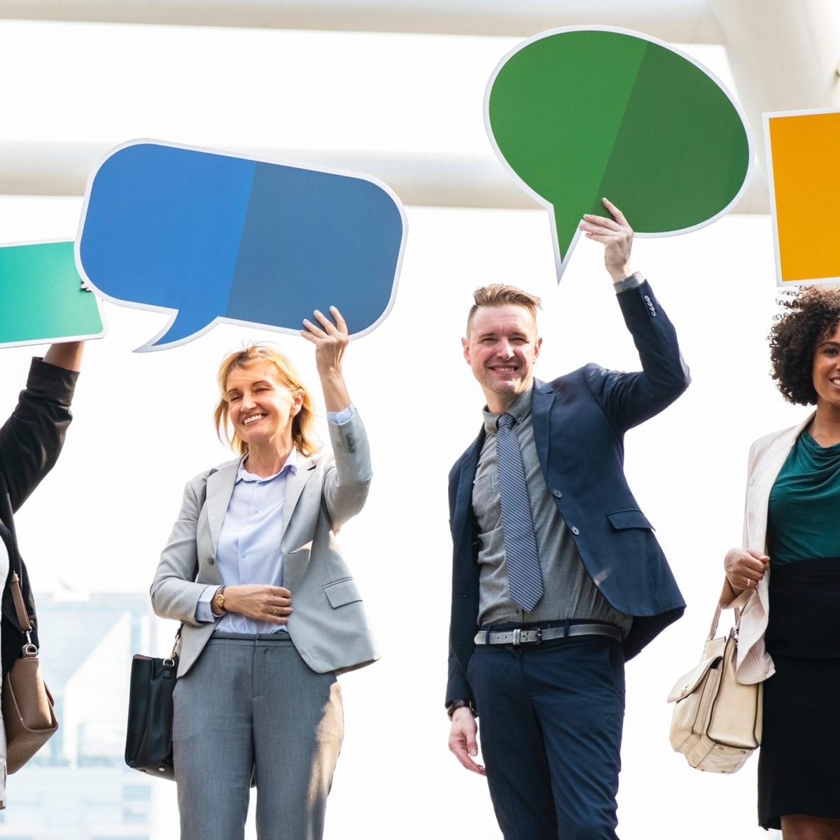 people holding text bubbles